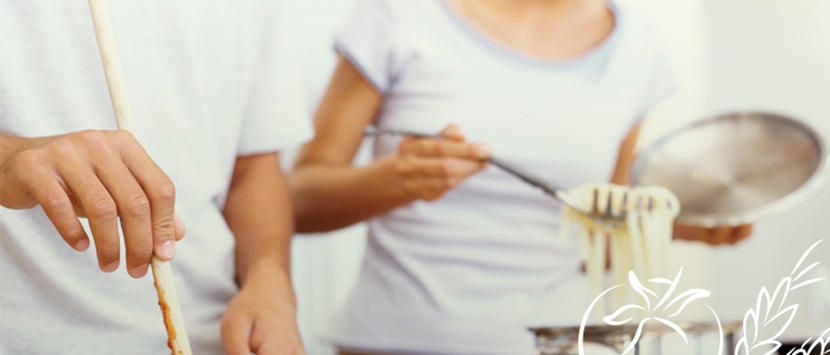 two people cooking